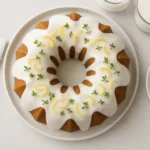 Lemon zucchini cake with lemon glaze on wooden table