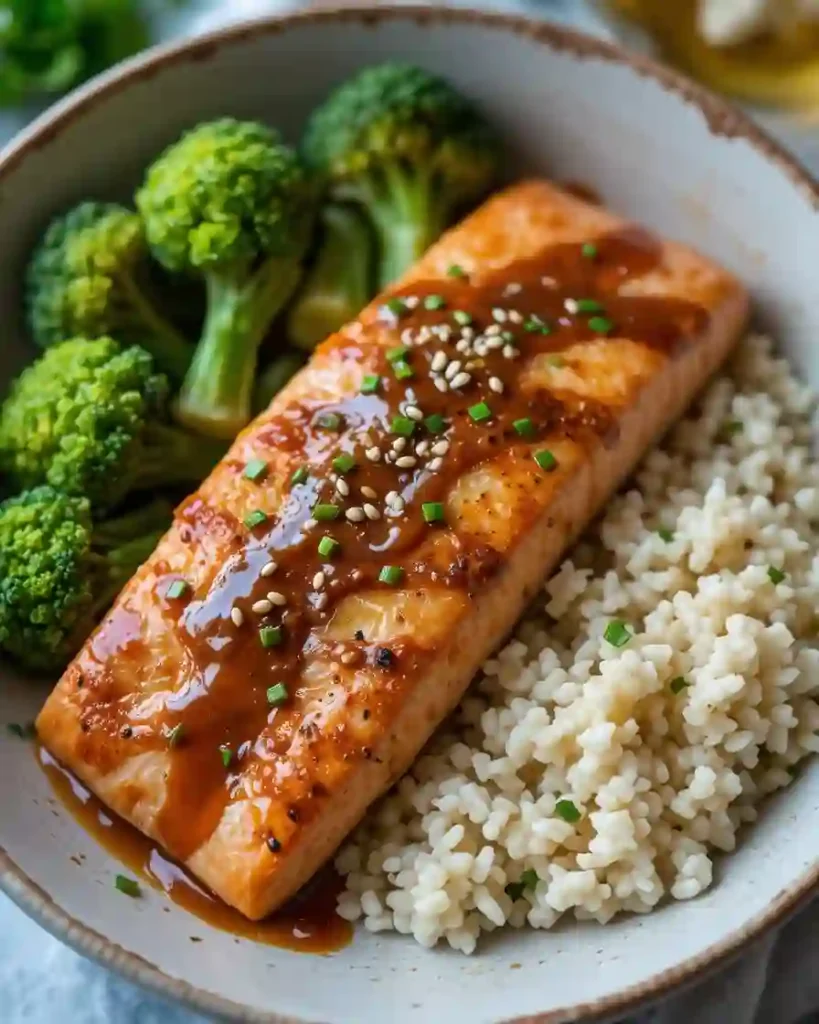 Serving Bang Bang Salmon with rice and broccoli