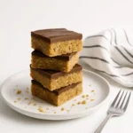 Scotcheroos squares served on a plate